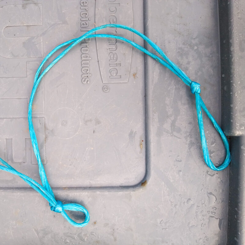A length of blue baling twine.