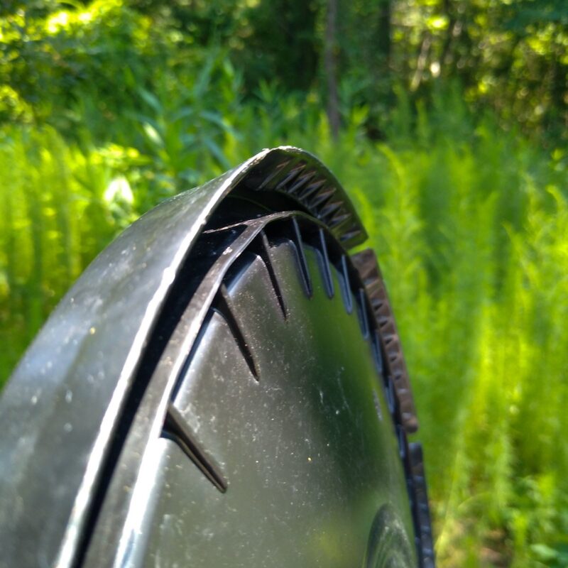 Close up of bucket lid edges showing sharp rim.