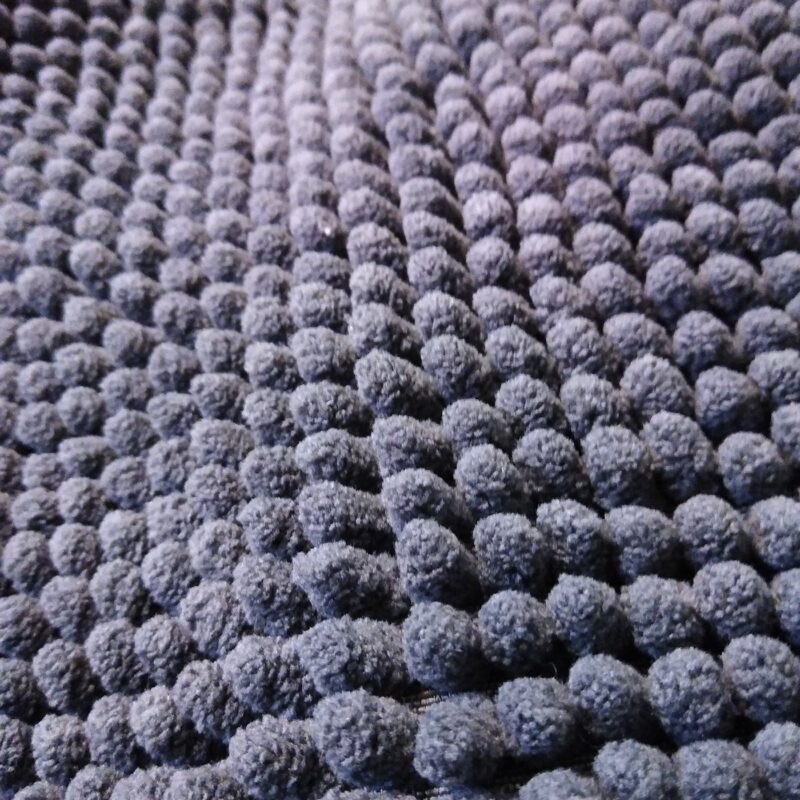 A close up of gray chenille fabric used as texture for the horse stall texture board.