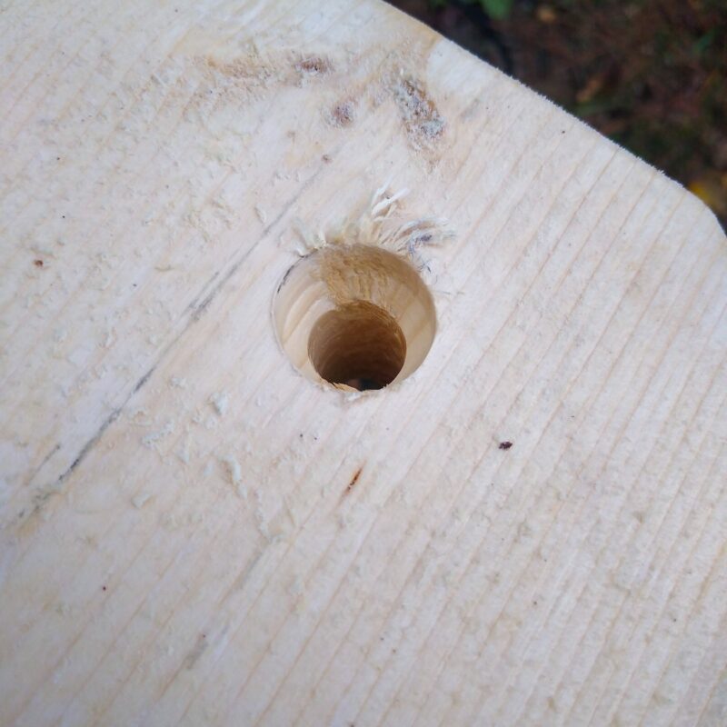 A hole that has been countersunk with smooth sloping edges.