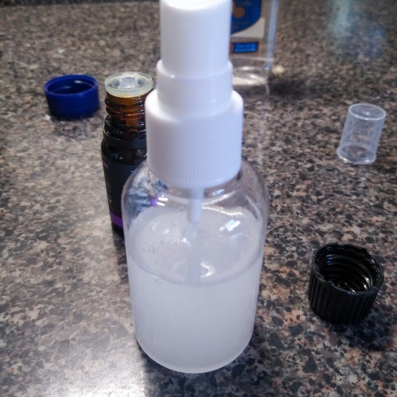 Finished essential oil spray for horse scent enrichment showing mixed, cloudy liquid