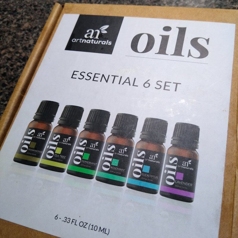 Close up of Art Naturals essentials oils kit with six essential oils. 