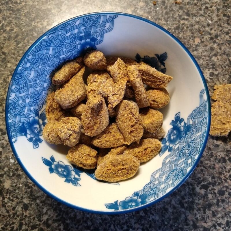Homemade horse treats in blue and white ceramic bowl.