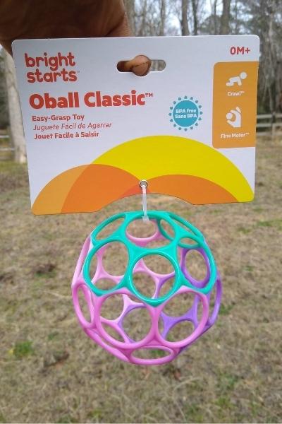 Bright Starts Oball Classic toy for babies in pastel pink, purple, and green.