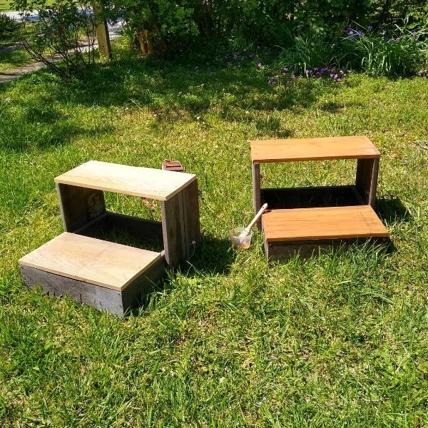 Two finished mounting blocks for horses, one with stain and one without.