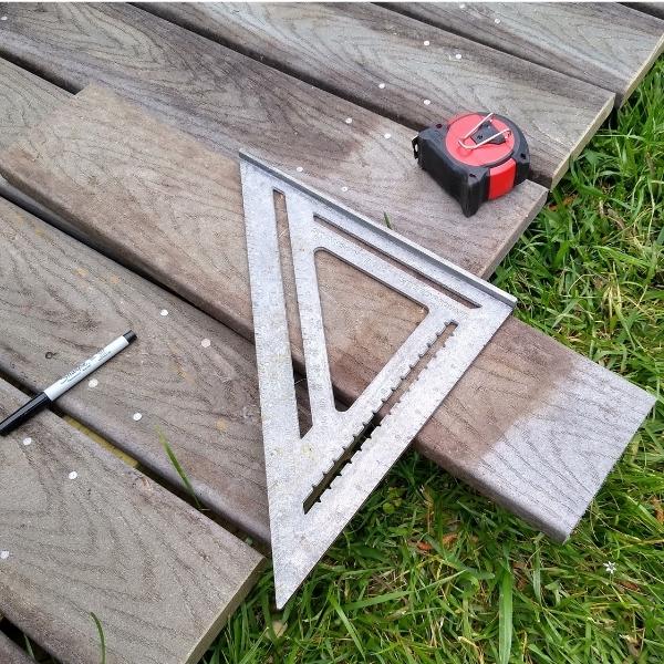 A carpenter's square on wood shows how to make a DIY mounting block with correct corners.