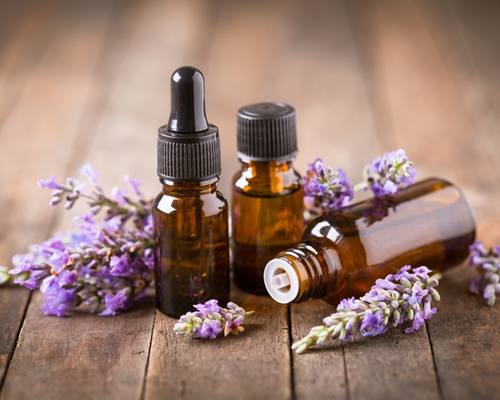 Lavender essential oil against a wood background, to be used as scent enrichment for horses