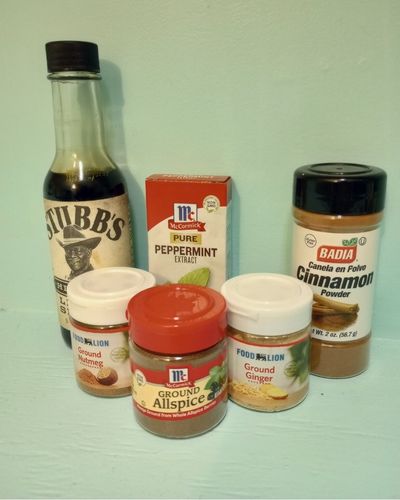 Selection of equine scent enrichment options from grocery store. From left to right, liquid smoke, peppermint extract, ground nutmeg, allspice, ginger, and cinnamon. 