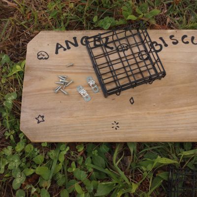 Social scent board for horses enrichment in process of construction showing scent cage and hardware before installing the DIY horse toy.
